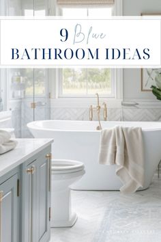 a white bath tub sitting under a window next to a sink and toilet in a bathroom