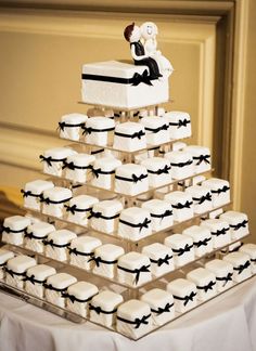 a wedding cake made to look like it is stacked on top of eachother