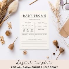 the baby brown birth announcement is displayed next to dried flowers and other items on a white background