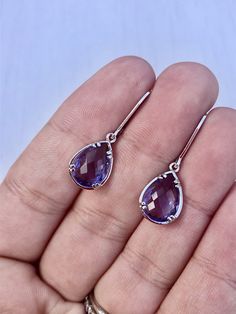 Amethyst Earrings, February Birthstone, Purple Teardrop Gem Earrings in Gold or Silver, Purple Jewelry, Lavender Earrings, Gift for women These small but gorgeous earrings feature deep purple amethyst teardrops bezel framed in either 14k gold filled or sterling silver. The teardrops are suspended form lever back ear wires in the finish of your choice. These are small, delicate and dainty earrings but with a gorgeous lavender color sure to match many outfits. Ideal for a girl or a women that like Elegant Amethyst Teardrop Dangle Earrings, Crystal Briolette Earrings As Gift, Elegant Lavender Earrings With Ear Wire, Purple Amethyst Drop Teardrop Earrings, Purple Amethyst Teardrop Earrings, Lavender Gemstone Earrings, Pierced Amethyst Crystal Earrings, Elegant Nickel-free Lavender Earrings, Elegant Lavender Nickel-free Earrings