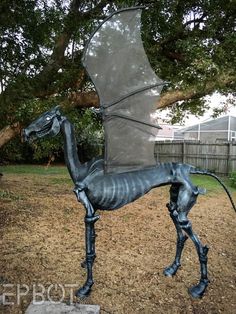 a statue of a horse is in the yard