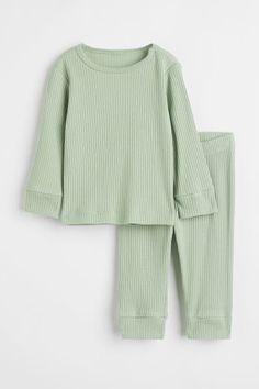 Ribbed Cotton Set - Light green - Kids | H&M US 1 Cotton Sets With Ribbed Cuffs For Spring, Ribbed Spring Sleepwear, H&m Long Sleeve Tops With Ribbed Cuffs, Solid Ribbed Loungewear Set, Stretch Cotton Long Sleeve Sets, Casual Cotton Sets With Ribbed Cuffs, Solid Color Cotton Sets With Long Sleeves, Ribbed Long Sleeve Loungewear Sets, Stretch Cotton Winter Sleepwear