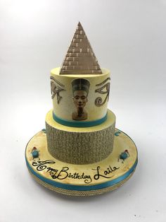 a three tiered cake with an egyptian theme