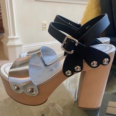 Brand New Prada Black And Silver Leather Wood Clogs In Size 38.5, Us 8.5. Never Worn, In Perfect Condition. Silver Block Heel Shoes With Leather Sole, Silver Block Heel Heels With Leather Sole, Silver Heels With Leather Sole And Block Heel, Leather Clogs With Wooden Heel For Party, Leather Party Clogs With Wooden Heel, Party Leather Clogs With Wooden Heel, Silver Leather Platform Heels, Leather Clogs With Round Toe For Party, Leather Round Toe Clogs For Party