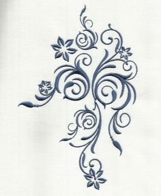 an embroidered design on a white shirt with blue flowers and leaves in the center,