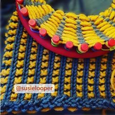 a close up of a purse made out of yarn