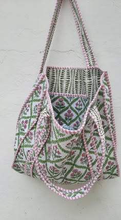 The Indian Hand Block Printed Cotton Quilted Women's Handbags from Rajasthan India. This Handbag is completely Indian Printed on good quality cotton. Cotton quilted travel Bag made by Indian Artisans, this cotton quilted shopping bag is totally unique and multi purpose. Use this for your grocery or as a travel bag. Perfect to suit all. Perfect Gift For her Item :- Cotton Handbag Material: 100% Cotton Pattern: Floral Print Was Care - Home Washable Style: Tote Bag Tote Bag -  Color - (we will Send Assorted Color And Pattern) Size in Inch:- Height-17" inch Width- 15" inch Handle-12" inch Product Work: Printed & quilted Stitched Usage : Cosmetic, Make-up, Travel, Toiletries, Medicine, Accessories, Shopping and much more. Perfect for Beach Visits/ Quick Grocery runs/ Carrying Kids items/ Artist Quilted Canvas Bag, Traditional Rectangular Bucket Bag For Everyday Use, Traditional Rectangular Bucket Bag For Everyday, Bohemian Rectangular Bucket Bag For Daily Use, White Bohemian Bag With Removable Pouch, Bohemian White Bag With Removable Pouch, Bohemian Pink Satchel Bag, Bohemian Pink Rectangular Bucket Bag, Pink Rectangular Bohemian Bucket Bag