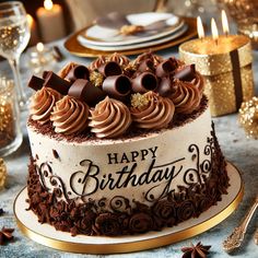 a birthday cake with chocolate frosting and sprinkles sits on a table