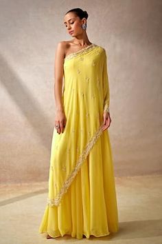 Yellow cape style sleeves one shoulder jumpsuit in georgette base with vine gardenia embellishments using cut dana highlights. - Aza Fashions Indian Readymade Saree, One Sided Sleeve Dress, One Shoulder Haldi Outfit, Jumpsuit Indian Outfit, One Shoulder Suits Indian, Side Open Kurti Designs, One Shoulder Indian Outfits, Indowestern Jumpsuit, Pooja Keyur