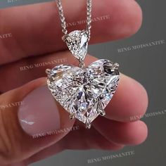 12 CT heart shape moissanite pendant necklace,18k/14k solid gold chain necklace,big Solitaire pendant Moissanite Necklace,Minimalist necklace DESCRIPTION  -------------------- *Moissanite Details  →Stone                            :Heart →Size (mm)                      :14*14 →Stone Total CTW          :12 →Color                              :Colorless →Clarity                            :VVS →Gold Purity                    :10k/14k/18k solid gold →chain length                :16 Inch * Metal Det Luxury Solitaire Necklace Gift, Luxury Classic Heart Necklace With Diamond Accents, Luxury Solitaire Necklace With Halo Setting As Gift, Luxury Heirloom Heart Pendant Jewelry, Luxury Heart Cut Solitaire Necklace, Luxury Diamond Pendant Necklace With Adjustable Chain, Luxury Heart-shaped Solitaire Necklace For Engagement, White Heart-shaped Moissanite Jewelry, Fine Jewelry Moissanite For Valentine's Day