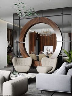 a living room filled with furniture and a round mirror