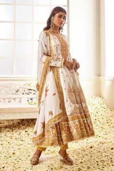 White anarkali with floral blossom print highlighted by placed thread embroidery and stone work. Comes with pant and dupatta. - Aza Fashions Traditional Lawn Suit With Intricate Embroidery For Reception, Anarkali Lawn Suit With Resham Embroidery For Reception, Anarkali Lawn Suit With Chikankari Embroidery For Reception, Unstitched Floor-length Lawn Suit With Intricate Embroidery, Festive Mulmul Sharara With Intricate Embroidery, Traditional Anarkali Set In Dola Silk With Floral Embroidery, Anarkali Set In Dola Silk With Floral Embroidery, Dola Silk Anarkali Set With Floral Embroidery, Anarkali Set With Floral Embroidery In Dola Silk