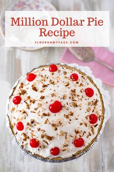 a pie topped with whipped cream, cherries and pecans is on a white table