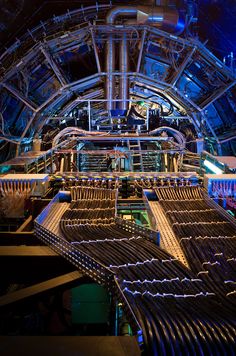 the inside of a large machine shop with lots of pipes and tubes on it's sides