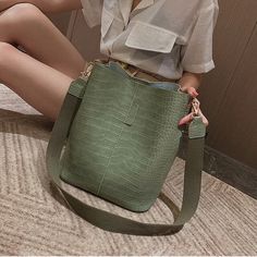 Megan Bag Material: PU Size(L*H*W): 24*28*16 Color: Brown, Black, Green, Beige, Khaki, Light Green Note: 1 Inch=2.54 CM; 1 CM=0.39 Inch , Due to different batches, bag's liner may be different. We pay your attention on the fact that different computer screens can display different colors even though this is one and the same color. Therefore color of the received good can be a little bit different than the good on the photo. Crocodile Handbags, Leather Backpack For Men, Plastic Shopping Bags, Real Leather Bags, Pu Leather Bag, Bucket Handbags, Women Shoulder Bag, Kelly Bag, Women Bags Fashion