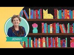 a woman standing in front of a bookshelf filled with lots of colorful items