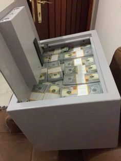 a bunch of money is in an open box