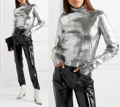 This black ribbed knit jumper has been coated in futuristic silver for a bold look.  Featuring a cropped length with a high neck, this piece has oversized sleeves with an attached envelope pocket.  Smooth shoulder and elbow patches are added for a modern, sporty look This turtleneck sweater - which channels the futuristic feel of the lineup - is knitted with cozy wool and  drenched in a layer of silver coating.  Pair yours with glossy patent-leather pants. - Silver Coated effect ribbed-knit  - E Identity Fashion, Patent Leather Pants, High Neck Shirts, Envelope Pocket, Oversized Sleeves, Oversize Sleeves, Extra Long Sleeves, Silver Tops, Elastane Fabric