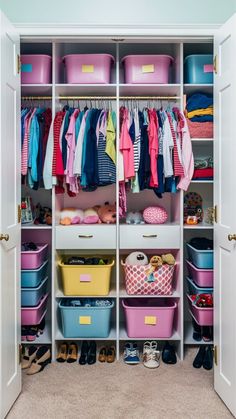 an organized closet with pink and blue bins