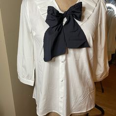 Cute Milk & Honey Bow Tie Blouse In Black And White. Bow Can Be Untied To Tie However Suits The Outfit. 3/4 Length Sleeve And Flowy Unstructured Fit. Never Worn Great Condition White Tie Neck Blouse For Office, Spring Office Wear Blouse With Bow, White Half Sleeve Office Blouse, White Half Sleeve Blouse For Office, White Bow Blouse For Workwear, White Bow Blouse For Work, Chic Blouse With Bow For Brunch, Elegant Half Sleeve Blouse For Daywear, Elegant White Half Sleeve Blouse