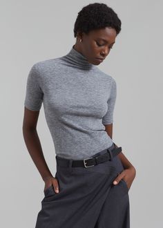 Color: Grey Grey Marl Fabric Slim fit Mock neck Short sleeves 60% Polyester 35% Rayon 5% Elastane Dry Clean The Frankie Shop. Imported The Frankie Shop, Frankie Shop, Simple Tees, Mock Neck Top, Crop Shirt, Limited Stock, Black Crop Tops, Black Blouse, Black Tee