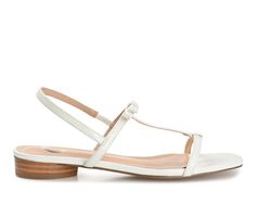 A sleek look for summer, the Zaidda by Journee Collection. This T-strap sandal features soft vegan leather and a padded insole for the perfect fit. A retro slingback strap and bow accent finish the design for an elevated finish. Luxe Vegan Leather upper, Pull-on entry, Approx. 1\ sole, Open toe, Padded footbed for added comfort, Man-made outsole, T Strap design / Minimal strap design / Slingback style / Bow detail | Women's Journee Collection Zaidda Flat Sandals in White Size 9 Medium T Strap Sandals, Design Minimal, Strap Design, Journee Collection, Sleek Look, T Strap, Bow Detail, Strap Sandals, Flat Sandals