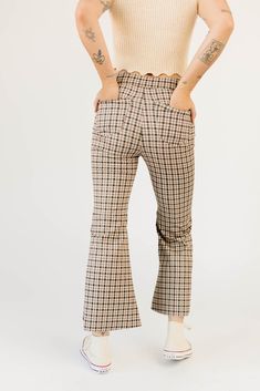 fall called + said you needed some high-waisted plaid pants. featuring a retro-inspired brown + red plaid pattern, these flared bottoms make your body look bomb. the perfect statement pants for date nights, office outfits, + everything in between; we love them dressed up with a blouse + heels, or down with a graphic tee + sneakers. burgundy // high waisted, flare leg, one bottom fly zip, back pockets paired with our kacey knit top model is 5'8" + wearing a small measurements are approximate + taken while laying flat small : waist 28” inseam 26.5” length 37.5” medium : waist 30” inseam 26.5” length 38” large : waist 32” inseam 27” length 38.5" more fit + fabric info : polyester, spandex // fabric has little stretch // fits true to size Plaid Fitted Straight Leg Bottoms, Plaid Flare Pants, Retro High Waist Plaid Pants, Fitted Plaid High-waisted Pants, Trendy Non-stretch Plaid Bottoms, Statement Pants, Plaid Trousers, Plaid Pants, Top Model