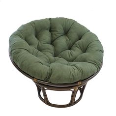 a round chair cushion sitting on top of a wooden table with wicker frame and legs