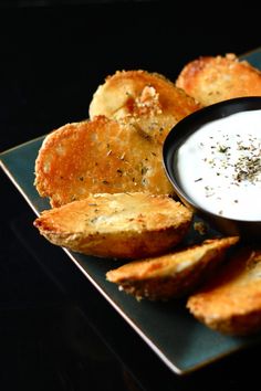 a plate with bread and dip on it