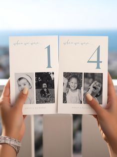 a person holding up an open photo book with pictures on the front and back of it