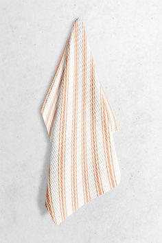 an orange and white striped dish towel