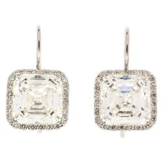 These earrings were made for the most sophisticated woman. 2 EGLUSA certified square emeralds totaling 10.04 carats are set to hang magnificently. They are near colorless and VS2 in purity. 0.48 carats of round brilliant cut precisely frame each diamond, creating the wonderful contrast between antique step cut and modern brilliant cut. Handcrafted in 18K white gold, they are certified and appraised for $243,000. Emerald Cut Diamond Earrings, Vintage Drop Earrings, Asscher Cut Diamond, Diamond Dangle Earrings, Step Cut, Asscher Cut, Silver Feather, Expensive Jewelry, Diamond Drops