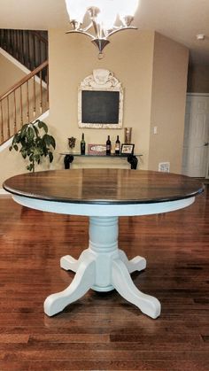 a dining room table in the middle of a wooden floor