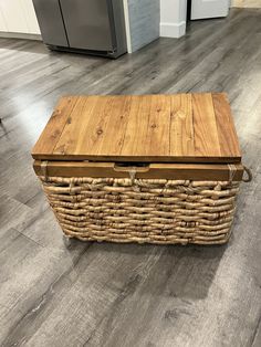 a large wooden box sitting on top of a hard wood floor