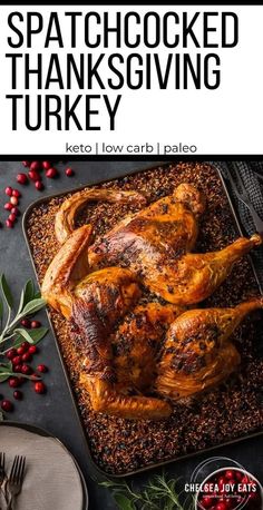 a roasted turkey on a pan with cranberries and spices