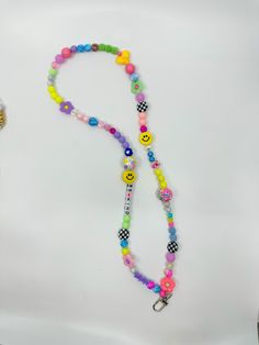 Fun and whimsical lanyard for a teacher or a student with smiley 😊 faces and hearts and very colorful. Fun Multicolor Lanyards As Gifts, Trendy Multicolor Lanyards As Gifts, Cute Multicolor Lanyard As A Gift, Fun Multicolor Lanyards For Gifts, Cute Multicolor Lanyards As Gift, Trendy Multicolor Lanyards For Gifts, Fun Adjustable Lanyards For Personal Use, Cute Multicolor Lanyard As Gift, Cute Multicolor Lanyard For Gifts