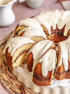 a bundt cake with white icing on a plate