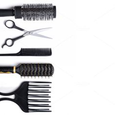 scissors, combs and hair brushes on a white background