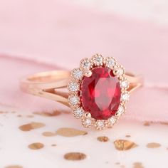 Oval Ruby Engagement Ring in Rose Gold Vintage Halo Diamond Band Oval Ruby Engagement Ring, Rose Gold Oval Engagement Ring, Winter Bridal Jewelry, Ruby Wedding Rings, Vintage Inspired Engagement Rings, Ruby Diamond Ring, Vintage Halo, Ruby Rings, Round Halo Engagement Rings