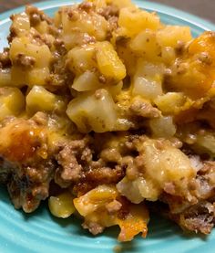 a close up of a plate of food with meat and vegetables on it, including potatoes