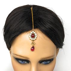 Gold plated Indian ethnic Bollywood style head ornament. Limited Availability. Metal: Alloy Plating: 5kt Gold (1 gm) Stone: Cubic Zirconia Material: Glass Length: 4 Inches Width: 0.75 Inch Style Tip: From casual look to bridal wear depending on your style and occasion. Wear it in the center of the forehead or on the side as shown in the picture. Style Personality: Antique Chic: You surround yourself with antique things that transport you in that era. You love the charm of antique things because Indian Head Jewelry, Red Bridal Hair, Maang Tika, Bridal Hair Jewelry, Head Chain, Head Jewelry, Hair Ornaments, Red Glass, Bollywood Fashion