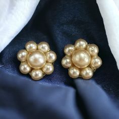 Circa 1960s Faux Pearl and Brass toned metal, Clip On Earrings in used condition, the backing is still strong and these earrings are wearable. 2 cms in diameter  All items are sold as is and with all Vintage items please be aware that some items may come with some wear and tear that can be expected with age. Please don't hesitate to ask for more details or pictures if you need them . All fees for customs are the responsibility of the buyer. If you have any questions please ask me, I will be happ 1960s Jewelry, Cluster Earrings, Clip On, Faux Pearl, Clip On Earrings, Favorite Jewelry, Etsy Earrings, Vintage Items, Etsy Accessories