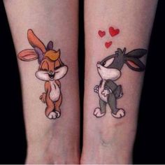 two tattoos on the legs of people that have rabbits and hearts tattooed on their arms