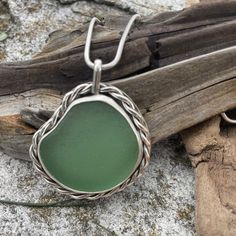 This beautiful piece of Sea Green Sea Glass was found on the French side of the beautiful island of Saint Martin. The bezel is wrapped with hand twisted wire. There is a sold back plate on the pendant. 925 Sterling silver and fine silver was use to create this pendant. 20" Snake Chain included Photos are taken outside in sunlight and shaded areas to show the way the light shines differently on the sea glass. (Today's photos are on a cloudy day) Sea Glass Pendant, Twisted Wire, Green Sea, Cloudy Day, Back Plate, Saint Martin, Sea Glass Jewelry, Sea Green, Beautiful Islands