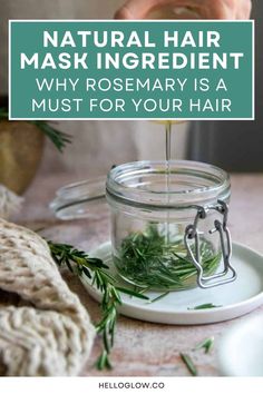 A glass jar filled with fresh rosemary sprigs sits on a plate while liquid is poured into it.