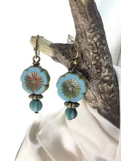 Pretty blue Czech glass flower beaded dangle drop earrings. Handmade, artesian earrings created with a large 14mm Czech glass flower bead in a beautiful robin egg or sky blue color. The hibiscus flower bead has a red/brown wash to it, so it matches very nicely with the accent bead below it. Bronze hooks, wires, and accent beads make this a warm, fall style. A short earring style, measuring 1-3/8 inches from the top of the hook. This a perfect gift idea for Mother's Day or anyone who loves floral Czech Beads Jewelry, Bead Earring, Floral Jewelry, Earring Gift, Earrings Flower, Earrings Dainty, Moon Jewelry, I Love Jewelry, Floral Jewellery