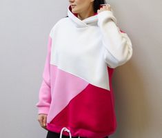 Introducing our Pink Colorblock Oversized Hoodie - a trendy and graphic masterpiece that blends comfort with aesthetics! Elevate your style with this unique Graphic Hoodie, crafted for those who appreciate the perfect fusion of fashion and coziness. Unveil the charm of our Patchwork Sweatshirt, a pullover hoodie that stands out in the world of aesthetic clothes. Whether you're looking for a bold statement piece or a cozy, oversized favorite, our collection has it all. Shop now and redefine your Cheap Patchwork Casual Hoodie, Trendy White Patchwork Sweatshirt, White Oversized Patchwork Sweatshirt, White Hooded Top With Contrast Color, White Hooded Hoodie With Contrast Color, White Fleece Color Block Tops, White Color Block Fleece Tops, Sporty Hooded Sweatshirt With Color Matching, Long Sleeve Fleece Hoodie With Contrast Color