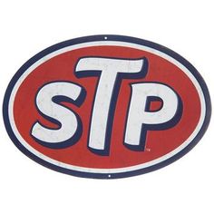 a red and white sign with the word stp on it's center circle