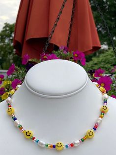 Show everyone how happy you are by wearing happy faces! Cute, chic, and fashionable. Cute addition to summer fashions! Smile Face is Acrylic and 10mm Rainbow Iridescent Seed Beads Freshwater Pearls 10mm - 12mm Necklace is 15 inches with a 2.5 inches extender Please message me if different size is needed Y2k Smiley Face, Smiley Face Necklace, Face Fun, Fork Jewelry, Micro Mosaic Jewelry, Rainbow Iridescent, Summer Fashions, Beads Ideas, Happy Faces