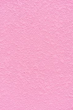 a pink wall that has been painted with some paint on it and is very soft